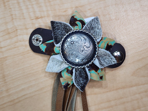 Handmade Leather Flower with concho center and 10 inches of fringe.